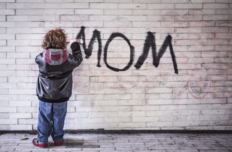 Contributing to the Delinquency of a Minor Defense Attorney in Vista 1 A juvenile delinquent child graffitis "mom" on the wall